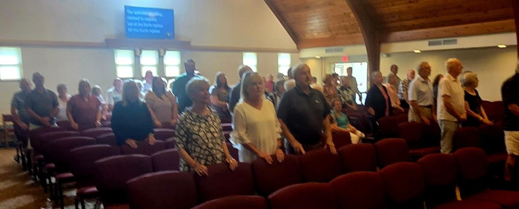 People standing together in the King Road sanctuary